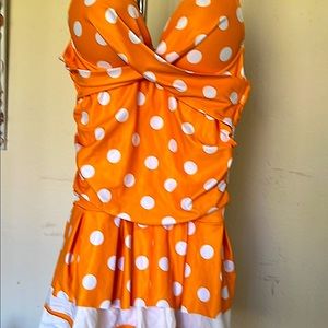 size small cute one piece. New without tags. do not know where it is from.